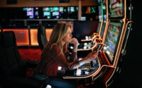 Women gambling on slot machinery